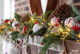 Fireplace mantels are always fun to decorate, especially with christmas decorations. Red And Rustic Christmas Mantel Holiday Decorating Ideas