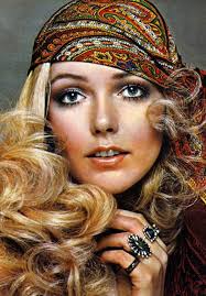 1970 S Curls And Makeup Complete With Patterned Bandanna And Flashy Rings 70s Hair And Makeup 1970s Hairstyles 70s Makeup