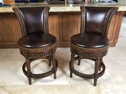 Frontgate's designs are mostly traditional with both backed and backless options with mostly upholstered designs. Pair Of Frontgate Wooden Swivel Counter Height Bar Stools