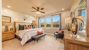 A Spacious Master Bedroom With An Accent Wall Of White Shiplap A Few Large Windows Allow For Natural Light Fo Master Bedrooms Decor White Shiplap House Prices