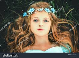Beautiful Romantic Blonde Girl With Blue Eyes Posing In Forest Dreaming Princess In Fairy Blue Dress And Hair Accessories Enjoyin Blonde Girl Blonde Beautiful