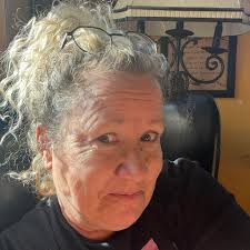 What helpers are needed for baking and researching items for the garage  sale?