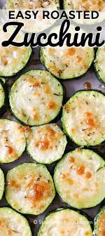 Oven Baked Zucchini Is Seasoned With Herbs And Topped With A Delicious Parmesan Crust This Side Is So Ea Zucchini Recipes Baked Bake Zucchini Zuchinni Recipes