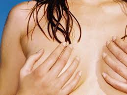 It images one breast pendant inside an imaging tank filled with water while a woman lies prone on a bed. 12 Tips For Good Breast Health Self