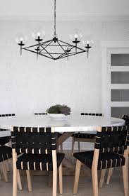 Modern Clean Dining Room With Table By Rh Philip Jefferies Wallpaper And Arteriors Chandelier Beach House Decor Wood Patio Chairs White Beach Houses