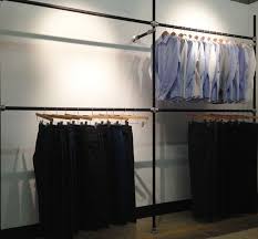 The freestanding clothing rack or closet can be custom made to fit your space. Diy Garment Rack For Men S Clothing Showroom Wall Clothing Rack Diy Clothes Rack Wall Mounted Clothing Rack