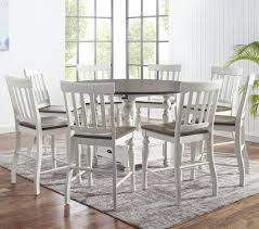 Explore our unique selection of dining tables in a variety of styles, ranging from rustic to stylish. Steve Silver Joanna 9 Piece Farmhouse Round Counter Table Set With Drop Leaves And Lazy Susan A1 Furniture Mattress Pub Table And Stool Sets