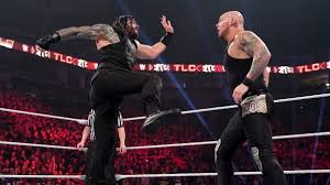 Photos The Big Dog Seeks Retribution Against King Corbin In Wild Tables Ladders Chairs Match Roman Reigns Tlc Reign