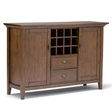 You can use a sideboard as a tv stand, or you can place it beneath a wall mirror or artwork for a stylish display. Simpli Home Redmond Sideboard Buffet And Winerack Aged Brown 54 In 3axcadm 08 Rona