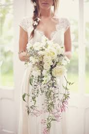 A large cascading bouquet made from home using artificial flowers and a net. Cascading Bouquet Wedding Ideas