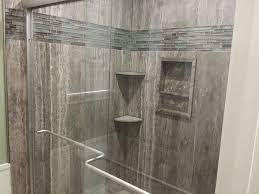 Done in simplistic river rock cement accented by the smooth profiles of the matte black telephone shower. Vein Cut Silver Travertine Shower Traditional Bathroom Houston By Stonehenge Showers Houzz