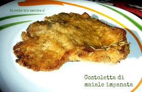 Una spessa e croccante panatura al. Costoletta Di Maiale Impanata Al Forno