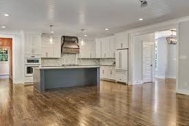 Kitchen With White Cabinets Blue Island And Wood Hood White Cabinets White Kitchen Cabinets Kitchen