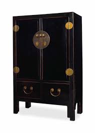 Zuri furniture modern vortice sideboard in black and white high gloss lacquer with matte black legs. A Matched Pair Of Chinese Black Lacquered Cabinets