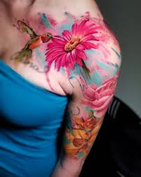 An arm watercolor tattoo of an astronaut. 15 Artists Of Watercolor Tattoo Inkppl