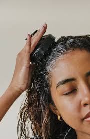 Scalp cleansing and massage brush.