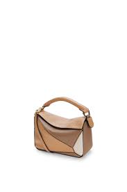 Adjust the slim calf leather strap to suit your carrying style on the shoulder or as. Mini Puzzle Bag In Classic Calfskin Warm Desert Mink Color Loewe