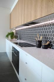 14 Stunning Splashbacks To Bring Your Kitchen To Life Black Hexagon Tile Kitchen Splashback Kitchen Design Modern Kitchen Best Kitchen Designs