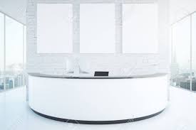 Dir beauty salon reception desk nbf signature esquire reception desk gw furniture modern glass white secretary front desk Modern White Reception Desk With Three Blank Posters In Interior Stock Photo Picture And Royalty Free Image Image 63390941