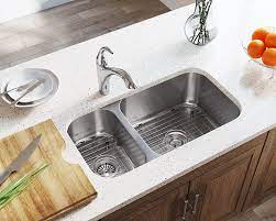 Our stainless steel undermount double bowl sinks have eliminated the ugly drain seam that hosts thousands of bacteria kitchen sink idea | double bowl ledge workstation. 3218br Offset Double Bowl Undermount Stainless Steel Sink