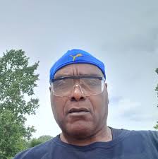 Which players are with Dr. J in the photo and which season is it from?