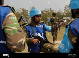 U.N. Peacekeepers from the Bangladesh Army discuss how to set up security  for a U.N. humanitarian distribution site as part of a field training  exercise during Exercise Shanti Doot 4, in Bangladesh.