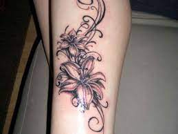 Sun + moon + heart design tattoo on leg. 50 Elegant Flowers Tattoos On Leg