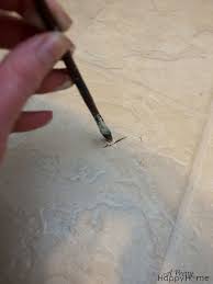 As the linoleum cools and the caulk begins to harden, smooth it out using your fingers. Repairing Nicks And Scratches In Linoleum Or Vinyl Flooring A Pretty Happy Home