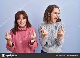 Mother Daughter Standing Blue Background Showing Middle Finger Doing Fuck  Stock Photo by ©Krakenimages.com 605670368