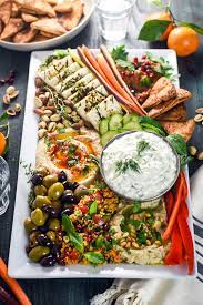 Grape leaves, roasted eggplant, sheep's milk cheese, olives, baklava. Mezze Party Platter Host The Toast