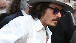 'scam' tattoo on his right hand. Johnny Depp Makes Shocking Change To Tattoos Inspired By Amber Heard Tattoo Ideas Artists And Models