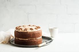 Coffee and walnut cake is a sponge cake made with additional coffee, usually either instant coffee or camp coffee, and walnut pieces. Coffee And Walnut Cake With Step By Step Photos Eat Little Bird