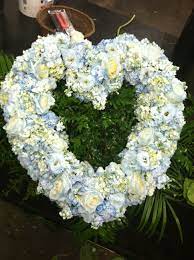 Mourners may light incense and bow to the family. Open Blue Heart Casket Spray Almost Done Flowers By David Casket Flowers Funeral Arrangements Funeral Flowers