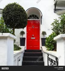 Front door entrance front door colors entrance ideas colored front doors front door lighting front door porch front door decor gray front this is our exact front door, exact color red, with the white trim. London May 3 Smart Image Photo Free Trial Bigstock