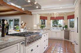 Custom white perimeter cabinets in combination with a cherry island finished in toffee, infuse warmth and welcome into this french country kitchen. French Country Kitchen Cabinets Pictures Options Tips Ideas Hgtv
