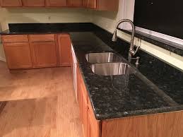 Love the look of this updated high bar and blanco silgranit double equal kitchen sink in cafe brown! Green Peacock Granite Countertops Installation