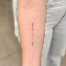 Ashley Tisdale S Fine Line Moon And Stars Tattoo Tattoos Simplistic Tattoos Star Tattoos