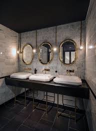 Black And Gold Art Deco Bathroom Dress Up An Industrial Interior With A Touch Of Gold And Luxurious Accessories Design Decor Commercial Bathroom Designs Restroom Design Restaurant Bathroom