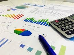 Businessman Analyzing Income Charts And Graphs With
