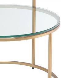 Casa Padrino Luxury Side Table Brass O 50 X H 57 Cm Round Stainless Steel Table With Tempered Glass Tops Luxury Quality A decadent style that adds elegance to your living room.