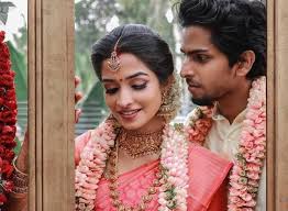 The bride and groom at the indian wedding garlands or jaimala ceremony. Wedding Portrait Ideas Using Wedding Garlands Flower Fashion India