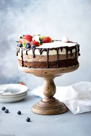 Triple Chocolate Mousse Cake On A Wooden Cake Stang With Three Distinct Chocolate Layer Triple Chocolate Mousse Cake Chocolate Mousse Cake Flourless Chocolate