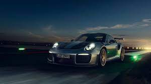 The 911 Gt2 Rs Set A Record Breaking Lap Time At The Nurburgring Besting The Previous Champ The Porsche 918 Spyder By A Whop Voitures Et Motos Voiture Motos