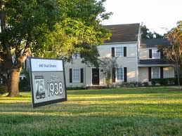 Here in 1938” signs highlight homes of historical significance