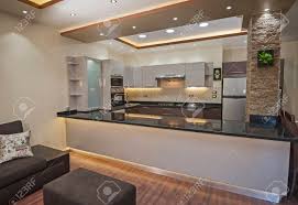 I need help visualizing and mixing our different styles into one cohesive design. Interior Design Decor Showing Modern Kitchen And Appliances In Luxury Apartment Showroom Stock Photo Picture And Royalty Free Image Image 75708717