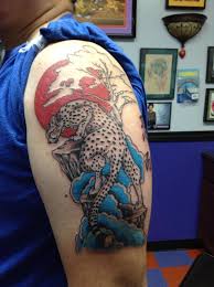 Snow leopard tattoos tend to be strikingly realistic for the sake of the metaphor, and they are usually designed with wide, inquisitive eyes. Snow Leopard By Cat Johnson Tattoonow