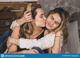 Tender Relationship in a Family of Lesbians, One Beautiful Woman Kisses Her  Partner. Close-up Portrait Stock Image - Image of adult, domestic: 215597333