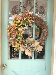 Glenn (courtesy southern living) example of a country entryway design in atlanta with a black front door windows around solid door. 16 Beautiful Floral Wreath Designs That Will Refresh Your Front Door