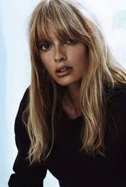 Her long hair with bangs is golden like the summer sun while her cut is a shaggy and layered one with 60s heavy bangs. Pin On Photography