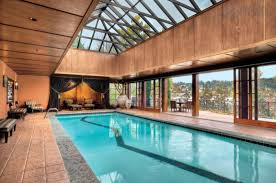 Who Says Swimming Is Just For The Outdoors In 2020 Pool Houses Luxury Swimming Pools Indoor Outdoor Pool